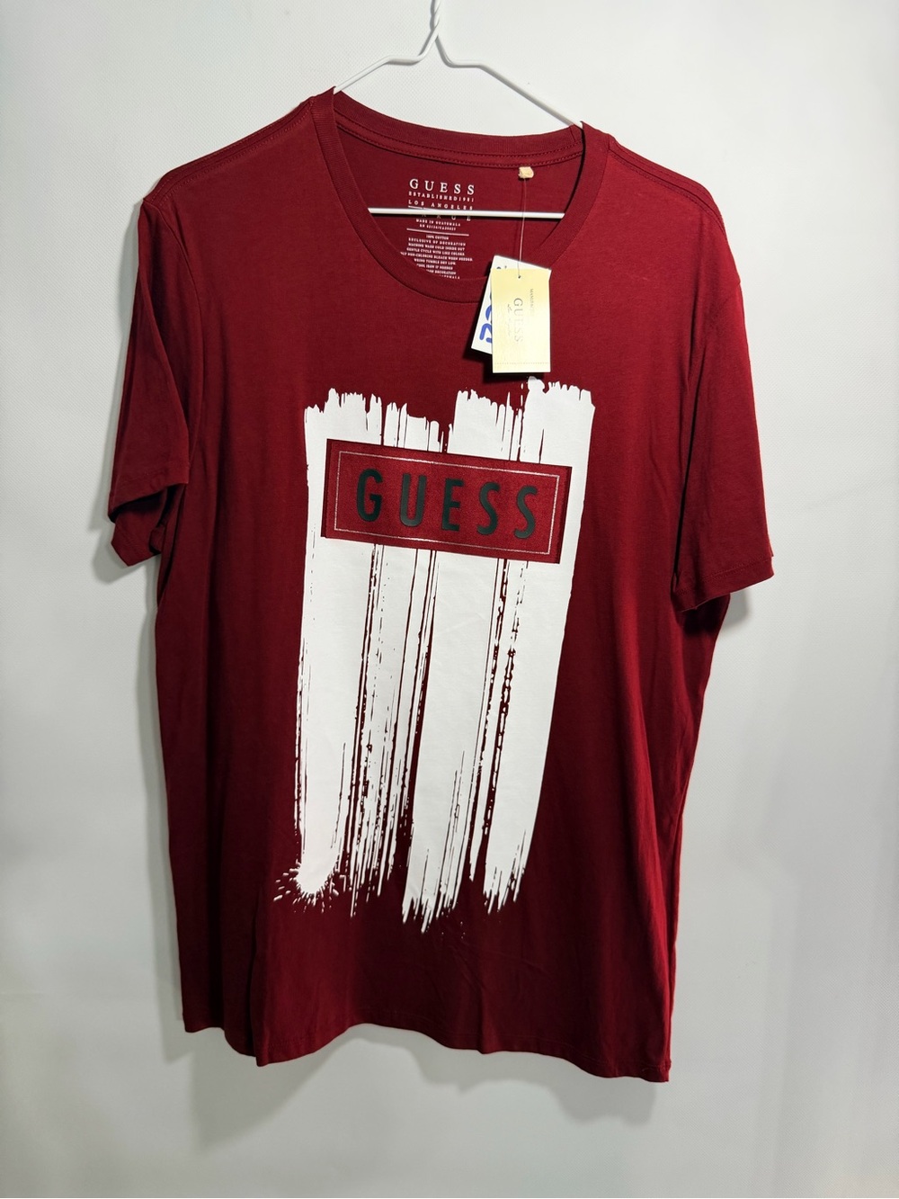 GUESS Men’s Burgundy Red Graphic Tee with White Brushstroke Logo